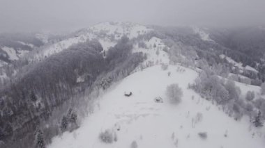 Winter aerial view of rural mountain landscape near Bran, in Transylvania, Romania