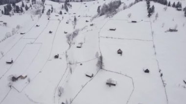 Winter aerial view of rural mountain landscape near Bran, in Transylvania, Romania