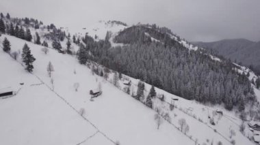 Winter aerial view of rural mountain landscape near Bran, in Transylvania, Romania