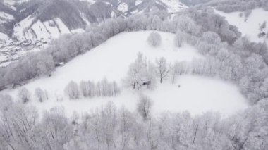 Winter aerial view of rural mountain landscape near Bran, in Transylvania, Romania
