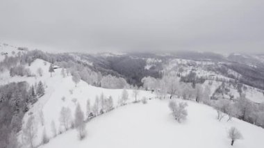 Winter aerial view of rural mountain landscape near Bran, in Transylvania, Romania