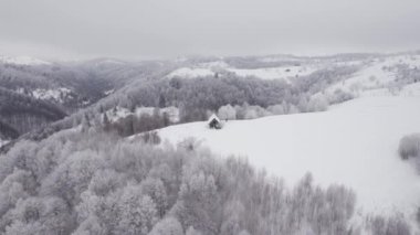 Winter aerial view of rural mountain landscape near Bran, in Transylvania, Romania