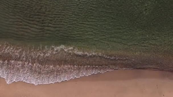Top view of the Black Sea beach, shote in Mamaia, Romania. Aerial drone footage of sea waves reaching shore.