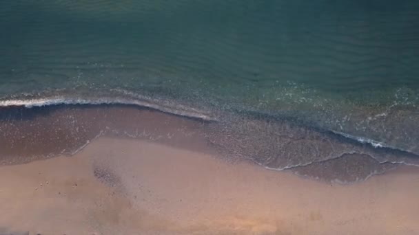 Top view of the Black Sea beach, shote in Mamaia, Romania. Aerial drone footage of sea waves reaching shore.