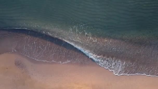 Top view of the Black Sea beach, shote in Mamaia, Romania. Aerial drone footage of sea waves reaching shore.
