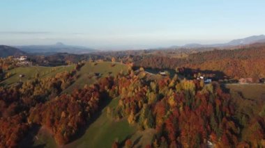 Autumn rural scene of the Romanian traditional village in Transylvania. Aerial colorful landscape at the foot of the Carpathian Mountains