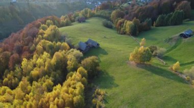 Autumn rural scene of the Romanian traditional village in Transylvania. Aerial colorful landscape at the foot of the Carpathian Mountains
