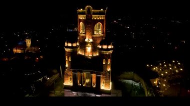 4K Aerial drone video of Gardos Tower in Zemun, Belgrade, Serbia on a clear winter night. Wonderful monument from Austro-Hungarian era standing out lit in the dark