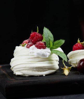 Baked cake made from whipped chicken protein and cream, decorated with fresh berries.	