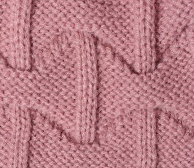 Texture of knitted pink fabric, close up