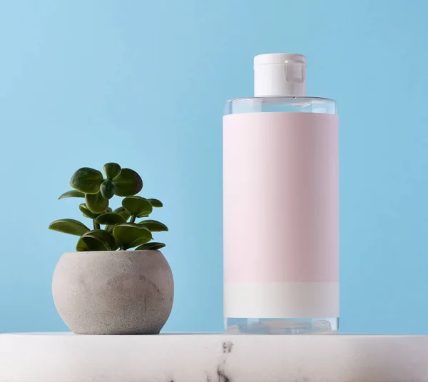 Blank Bottle Cosmetics Pink Paper Label Blue Background Bottle Tonic — Foto de Stock