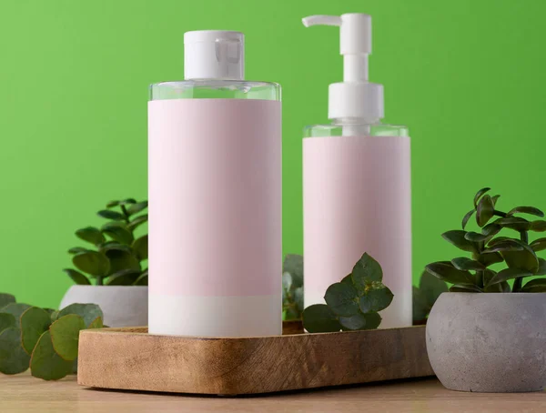 Two Bottles Cosmetics Pink Paper Label Green Background Bottle Tonic — Foto de Stock