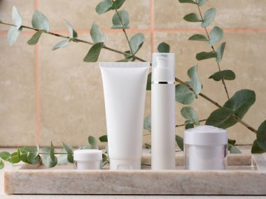 White plastic tube, jar for cosmetics. Container for gel, cream, tonic. Advertising and product promotion