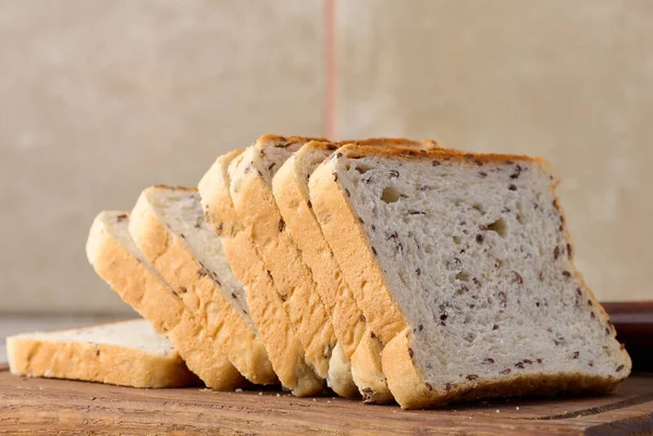 Sliced Rectangular Loaf Bread Flax Grains Wooden Cutting Board — Fotografia de Stock