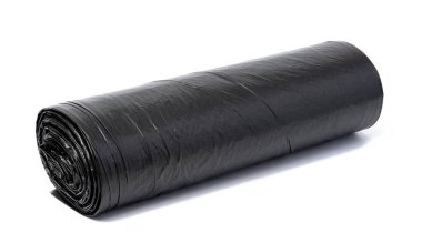 Twisted black polyethylene garbage bags on a white isolated background 