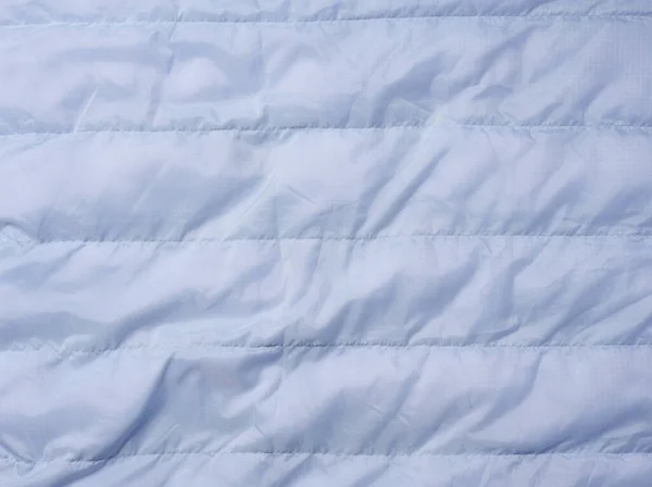Fragment Niebieskiego Materiału Puchem Wypełniającym Zszywającym Tkanina Kurtki Płaszcze — Zdjęcie stockowe