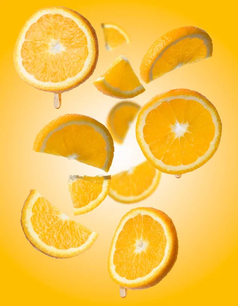 Various Pieces Orange Levitate Yellow Background Juicy Fruit — Stock Photo, Image