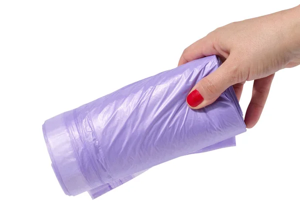 Kvinnas Hand Håller Rulle Plastpåsar För Papperskorgen Vit Isolerad Bakgrund — Stockfoto