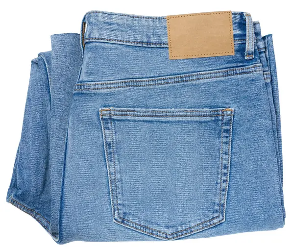 Opgevouwen Blauwe Jeans Een Witte Geïsoleerde Achtergrond — Stockfoto