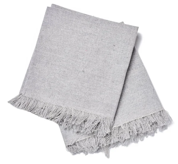 Katlanmış gri keten peçete beyaz izole bir arkaplan, üst görünüm
