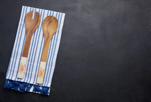 Two Wooden Spoons Striped White Textile Kitchen Towel Black Background — Stock Photo, Image