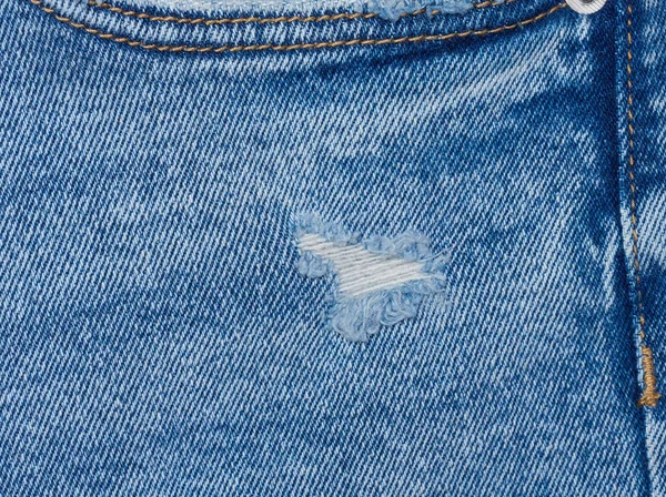 フルフレーム クローズアップと青いジーンズ生地の断片 — ストック写真