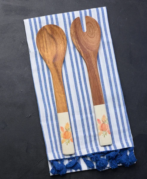 Two Wooden Spoons Striped White Textile Kitchen Towel Black Background — Stock Photo, Image
