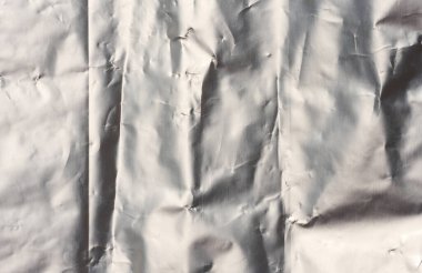 Crumpled sheet of gray foil, packaging material