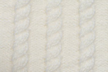 Beyaz yün ipliklerden örülmüş kumaş, at kuyruğu deseni, tam çerçeve. Kapat.