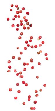 İzole edilmiş arka planda kavisli bir desen şeklinde dizilmiş pembe biber koleksiyonu. Aromatik böğürtlenlerin hafif bir çeşnisi vardır. Mutfak yemeklerinde baharat olarak kullanılır.