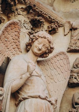 The Smiling Angel, also known as the Smile of Reims, a stone sculpture of the cathedral of Reims