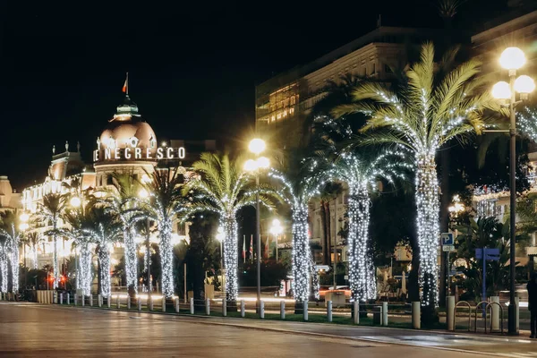 Nice, France - 20.12.2022 : Promenade des Anglais decorated for Christmas and facade of Hotel Negresco