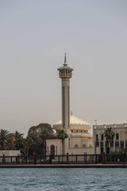 Dubai, United Arab Emirates - 28.04.2022 : The minaret of the mosque in the old part of Dubai, in the Deira district
