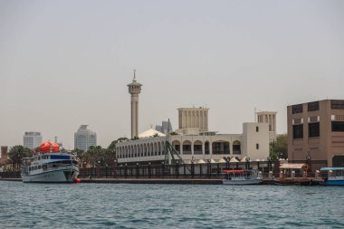 Dubai, United Arab Emirates - 28.04.2022 : The minaret of the mosque in the old part of Dubai, in the Deira district