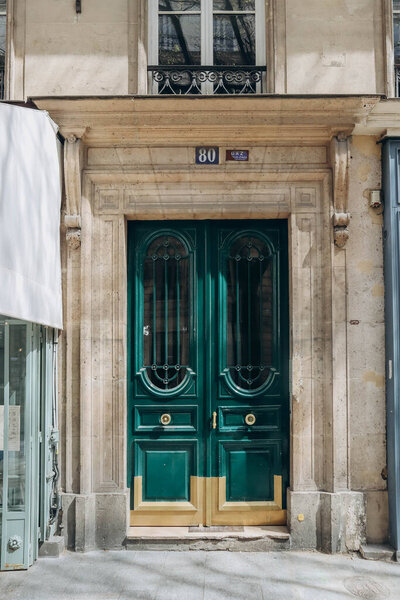Paris, France - 16 April 2023: Beautiful door in an old haussmann house in Paris