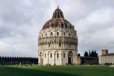 The Pisa Baptistery of St. John, a Roman Catholic ecclesiastical building in Pisa, Italy. clipart