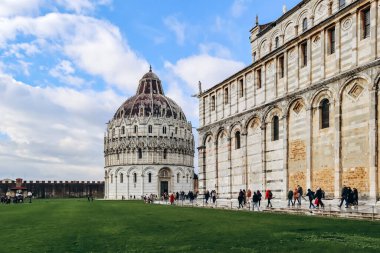 Pisa, Italy - 30 December 2023: The Pisa Baptistery of St. John, a Roman Catholic ecclesiastical building in Pisa, Italy. clipart