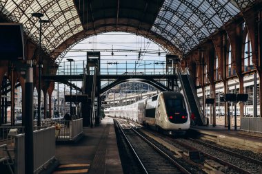 Nice, France - 6 January, 2024: TGV OuiGo train on the railway station platform in Nice clipart