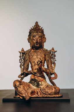 Nice, France - 19 November 2023 :  Bodhisattva, China, 15th century, Ming dynasty, gilded bronze. clipart