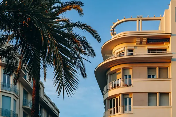 Building and palm tree on the Promenade des Anglais in Nice