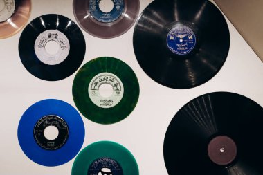 Doha, Qatar - 1 May 2024: Old vinyl records at the Qatar History Museum clipart