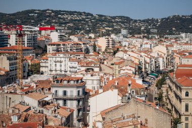 Cannes, France - August 1, 2024: View of the rooftops of Cannes on a sunny day clipart