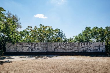 Budapest, Hungary - August 10, 2024: The Heroes of Peoples' Power Memorial, artist Kallo Viktor, 1983. Memento Park. clipart