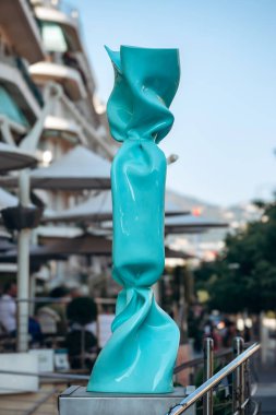 Nice, France - July 27th, 2024: Sculpture by Laurence JENK in the form of a candy, in front of the famous Boscolo Nice Hotel in Nice clipart