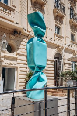 Nice, France - July 27th, 2024: Sculpture by Laurence JENK in the form of a candy, in front of the famous Boscolo Nice Hotel in Nice