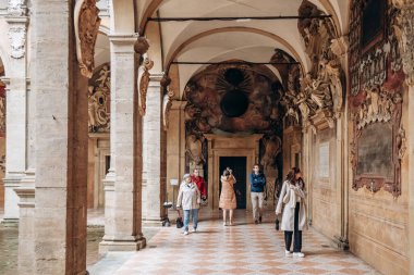 Bologna, Italy - October 6, 2024: The Archiginnasio of Bologna, one of the most important remains of university interior architecture from the past clipart