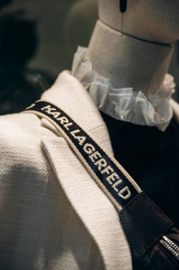 Nice, France - November 2, 2024: Karl Lagerfeld branded bag strap on a mannequin in a boutique window clipart