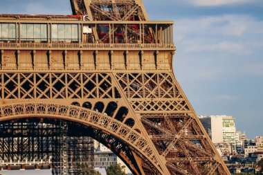 Paris, France - 15 July 2021: Close-up of a fragment of the Eiffel Tower during the golden hour clipart