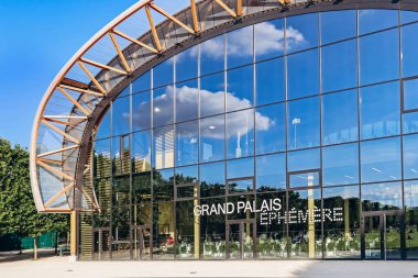 Paris, France - July 15, 2021: Grand Palais Ephemere in front of the Eiffel tower clipart