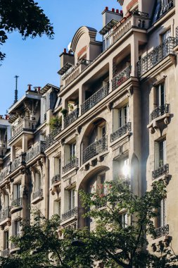 Paris, France - 15 July 2021: Facades of Parisian Haussmannian buildings in the 7th arrondissement clipart